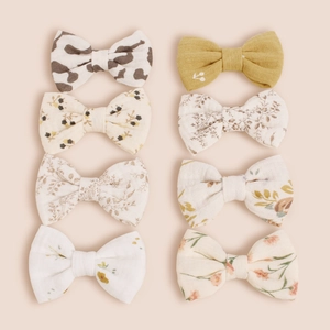 Lot de huit barrettes nœuds en coton avec motifs floraux et imprimé vache pour filles