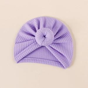Detailed knit texture of light purple baby turban hat with a cute donut knot design