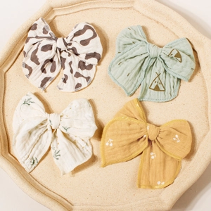 Set of 4 floral and leopard print bow hair clips in soft cotton gauze for girls