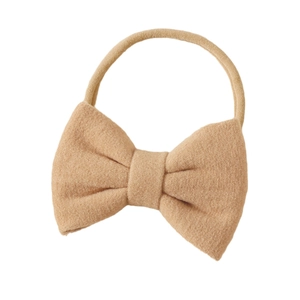 Solid cashmere bow baby headband with highly elastic nylon band in camel brown color
