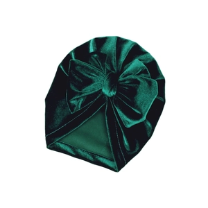 Dark green baby velvet turban hat featuring a decorative large bow on a white background