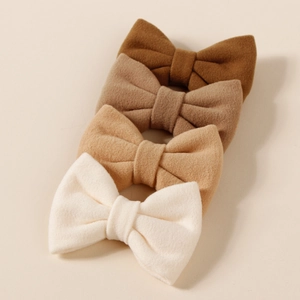 Set of 4 plush bow hair clips for girls in earthy tones of brown and cream white