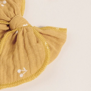 Handmade mustard yellow muslin bow hair clip with white cherry pattern for kids
