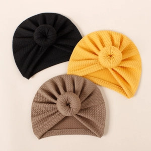 Set of three soft ribbed knit baby turban hats with donut knot detail in assorted colors