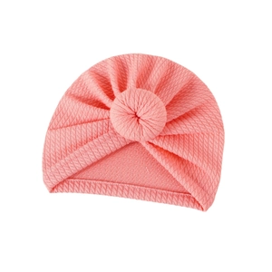 Pink waffle texture baby turban hat with a bohemian knot design for newborns