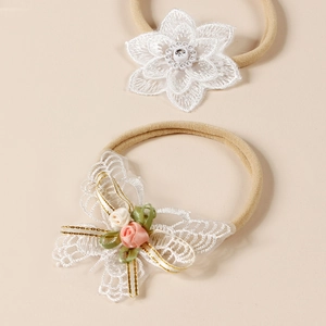 Bandeaux bébé en nylon souple avec fleurs en dentelle blanche et papillons brodés