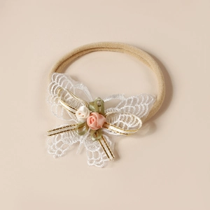 Bandeau bébé papillon en dentelle avec détails floraux sur bande nylon souple élastique