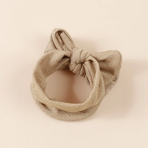 Bandeau bébé beige brillant avec grand nœud jacquard pour nourrissons et tout-petits