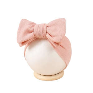 Bandeau élastique pour bébé avec un grand nœud double en jacquard rose poudré