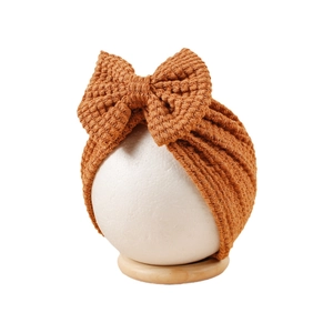 Bonnet turban tricoté pour bébé couleur caramel avec grand nœud pour nouveau-né