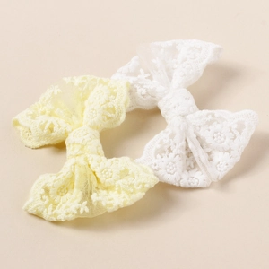 Set of 2 lace embroidered butterfly hair clips in soft white and pastel yellow colors