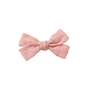 Pink embroidered lace bow hair clip for girls with minimalist white background