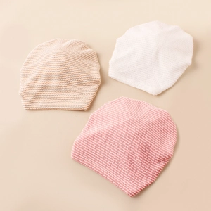 Three-piece set of striped baby turban hats with bow ties in beige, white, and soft pink