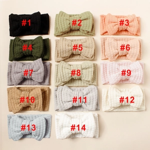 Detailed grid view showing 14 colorful waffle knit bow headbands for baby girls