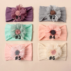 Detail view of 6 colorful floral baby headbands made of soft elastic jacquard nylon
