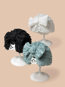 Set di tre turbanti per neonati con grandi fiocchi nei colori bianco, nero e verde salvia