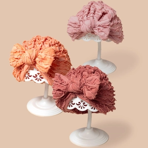 Turbanti elastici per neonati con grandi fiocchi in rosa, arancione e rosso per neonati