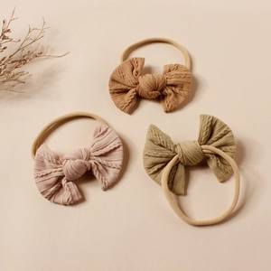 Drei Stück Jacquard-Strick Stirnbänder für Babys mit weichen Schleifen in Herbstfarben