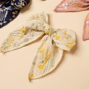 Handmade embroidered floral bow hair clips with minimalist cotton fabric for girls