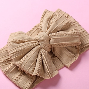 Bandeau bébé en nylon souple avec double nœud et motif jacquard tricoté en beige
