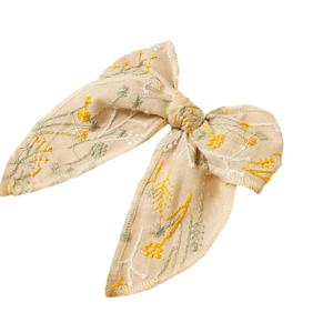 Elegant beige embroidered floral bow hair clip with long ribbon tails for women