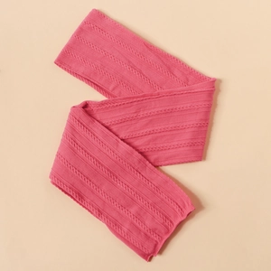 Detailed macro view of pink cable-knit nylon baby headband with soft textured jacquard fabric