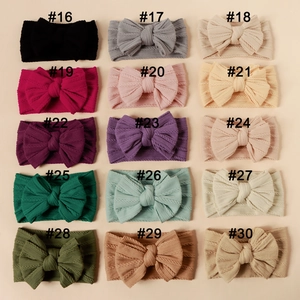 Detailed grid showing 15 colors of baby nylon headbands with large double layer bows