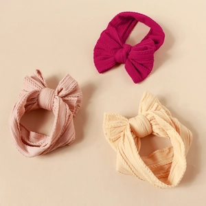Three-pack elastic nylon baby headbands with large textured jacquard bow details
