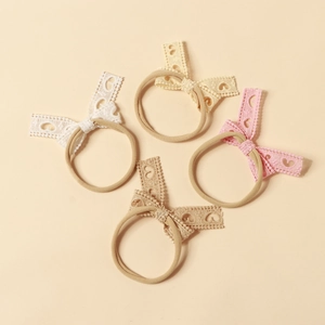 Set di 4 fasce per neonati con fiocco in pizzo in colori pastello per acconciature
