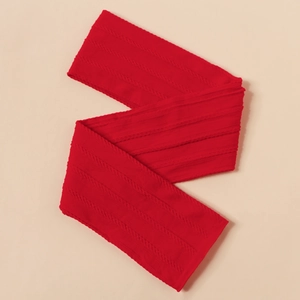 Detailed close-up showing the red cable knit texture and soft fabric of the baby headband