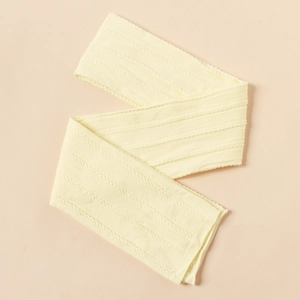 Detailed view of cream nylon jacquard fabric with cable knit pattern for baby headbands