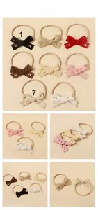 Detailed close-up of lace bow headband set with hollow hearts and elastic nylon bands