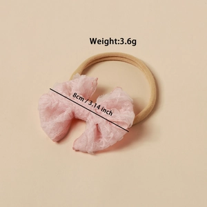 Detailansicht des rosa Spitze Schmetterlings-Stirnbands für Babys mit 8cm Maßen