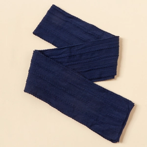 Detailed macro view of navy blue cable knit texture on soft elastic baby headband