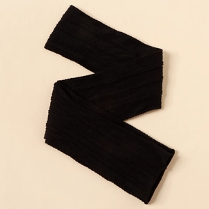 Close-up of black elastic nylon headband with textured cable knit jacquard for infants