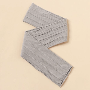 Close-up of grey cable-knit baby headband showing the elastic nylon fabric texture