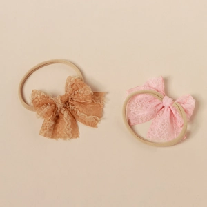 Set of two vintage lace bow headbands for babies in yellow and light pink shades