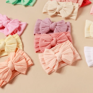 Multi-color baby nylon headbands with cable knit jacquard and large double bows