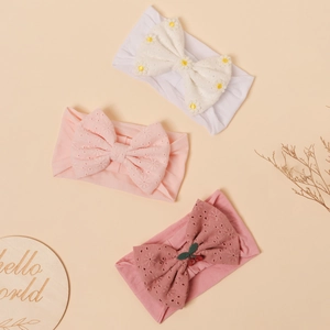 3-pack soft nylon baby bow headbands in white and pink with floral and cherry details