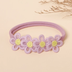 Detailed embroidery of purple flowers with yellow centers on soft nylon baby headband