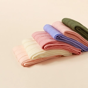 Elastic baby nylon jacquard headbands in various soft colors with hollow knit texture