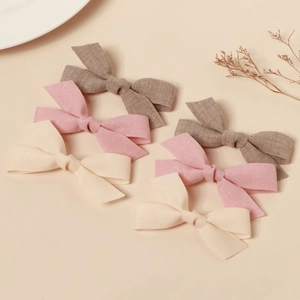 Set of 6 handmade fabric bow hair clips in brown, pink and beige natural tones