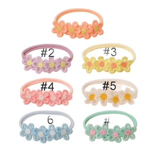 Set of seven soft nylon baby headbands with colorful lace embroidery flowers