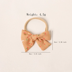 Bandeau souple en nylon pour bébé avec un nœud à carreaux et motifs cerises