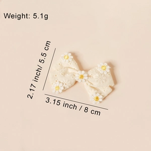 Barrette nœud en coton beige avec broderie marguerite et dimensions détaillées