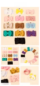 Detailed view of 13-color pack elastic nylon headbands with large solid bows for babies