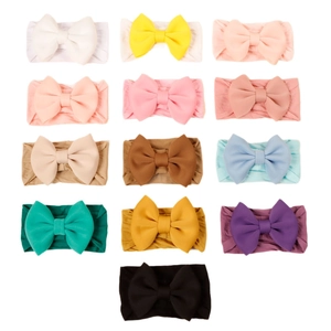 Set of 13 colorful soft nylon headbands with large solid color bows for baby girls