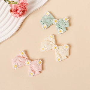 Lot de trois barrettes à nœuds en dentelle de coton avec broderie de marguerites