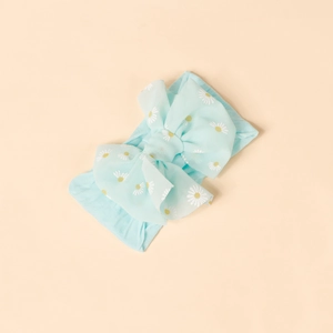 Detail of soft elastic light blue baby headband featuring white daisy prints and a large bow