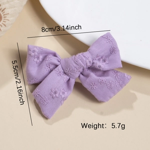 Handmade purple cotton bow hair clip for girls with floral embroidery and duckbill clip